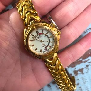 Seiko women’s windward kinetic gold steel watch